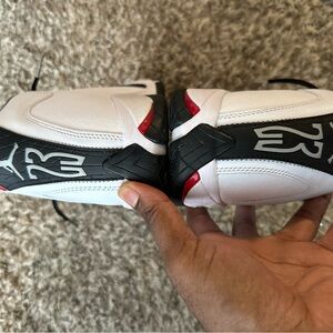 White and Black Sneakers with Red Accents